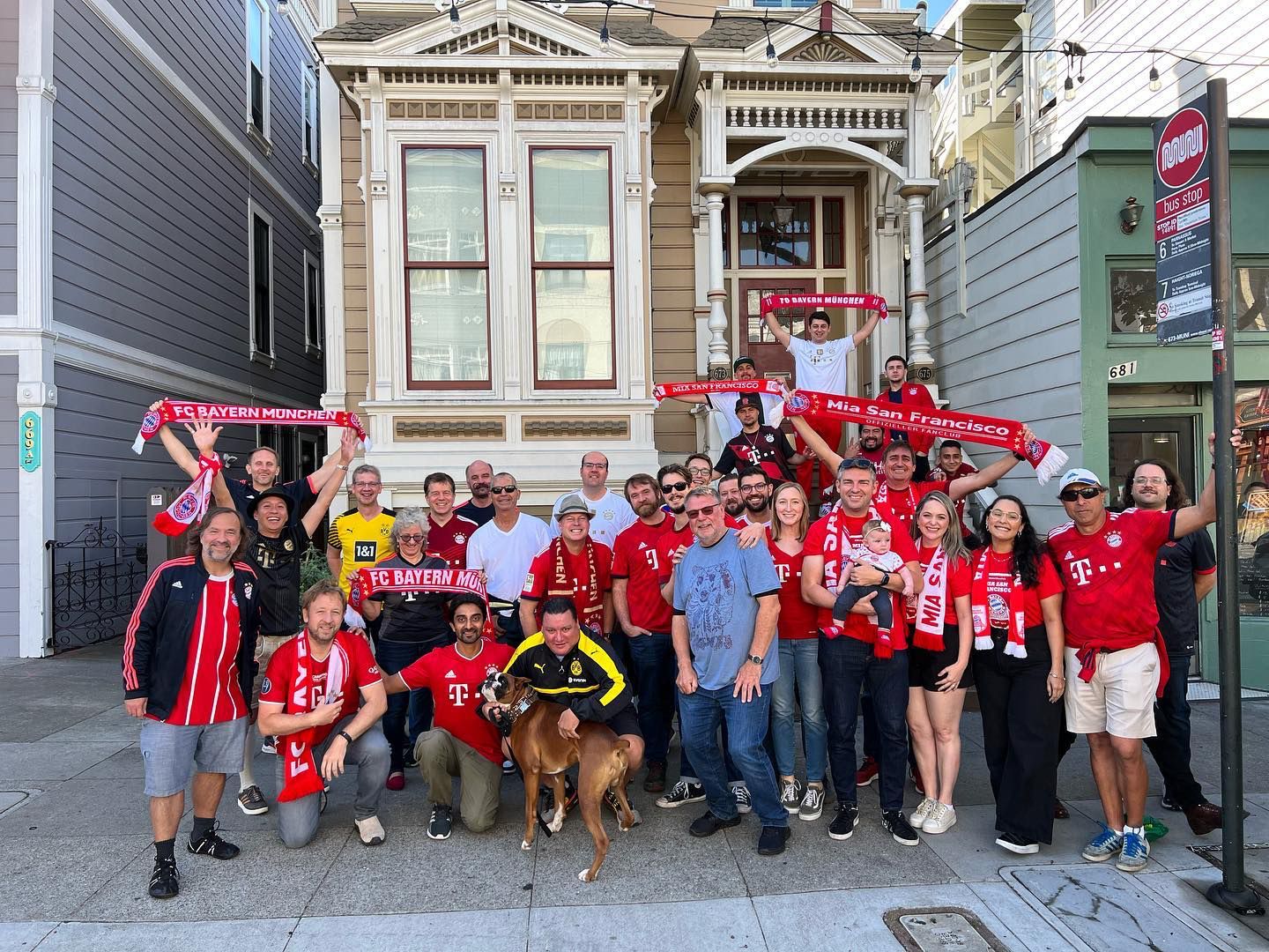 Group in front of Victorian houses